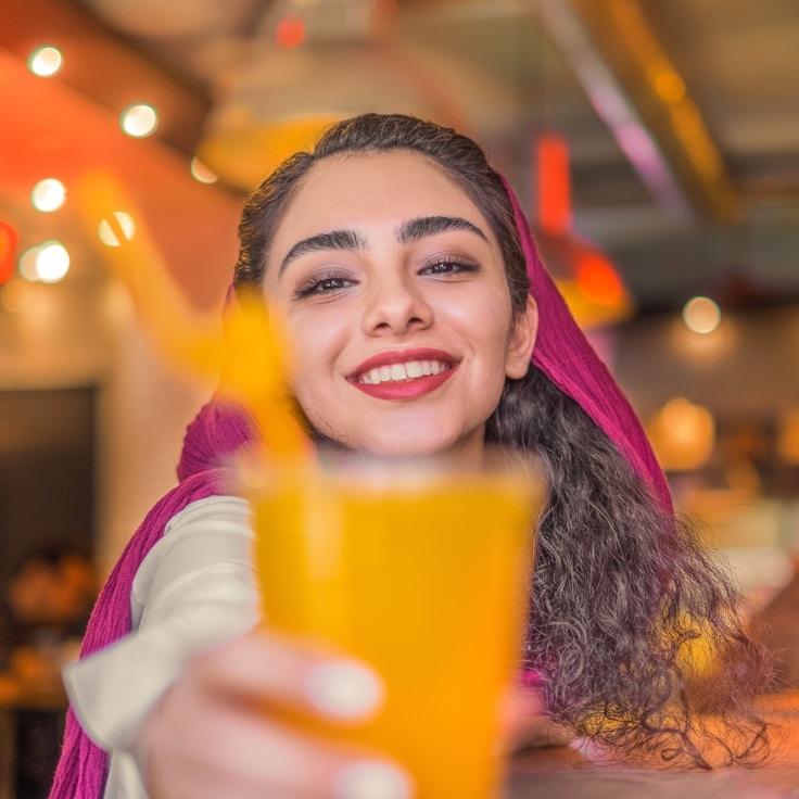 Avery Chen, Lead Design Curator at Studio Harvest Port, reviewing corporate floral arrangements